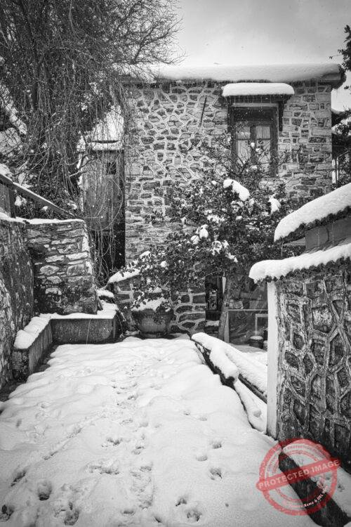 Front of a house juring snowstorm